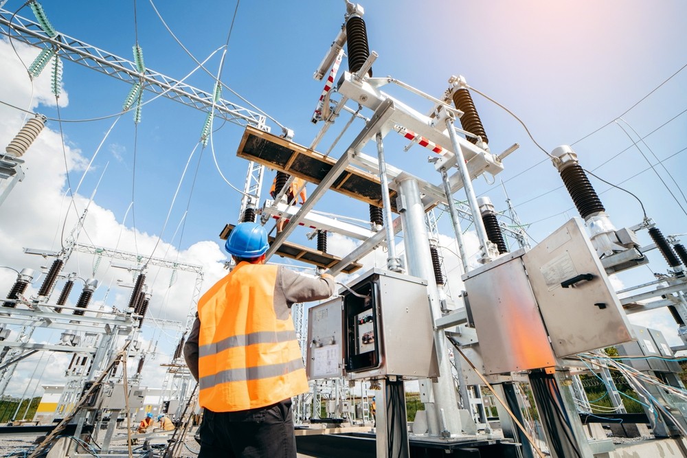 Skilled electrician at a high-voltage substation in Brisbane, ensuring safe and efficient power distribution