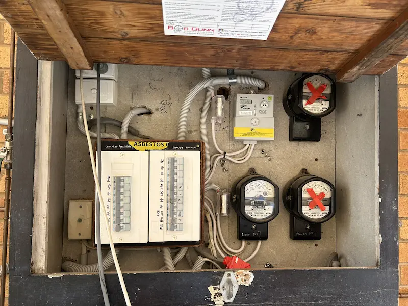Emergency electrician repairing dangerous switchboard Brisbane