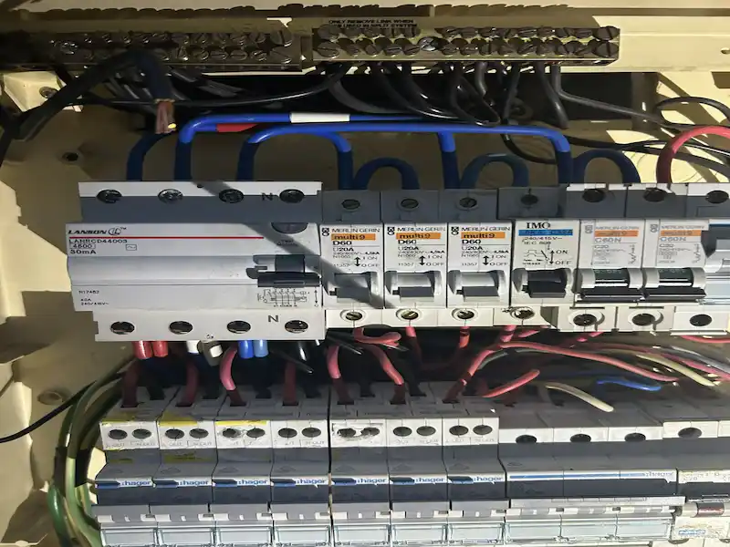 Emergency electrician repairing safety switch Brisbane