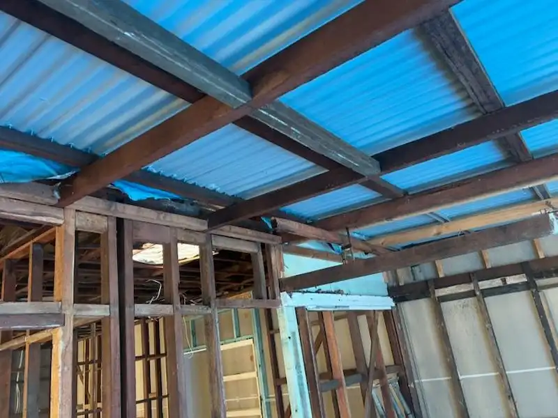 Timber frame house stripped back to the frame during a full home rewiring project in Brisbane