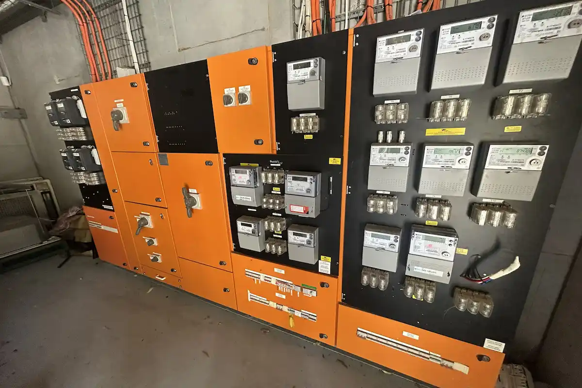 Strata electrician working on distribution board Brisbane